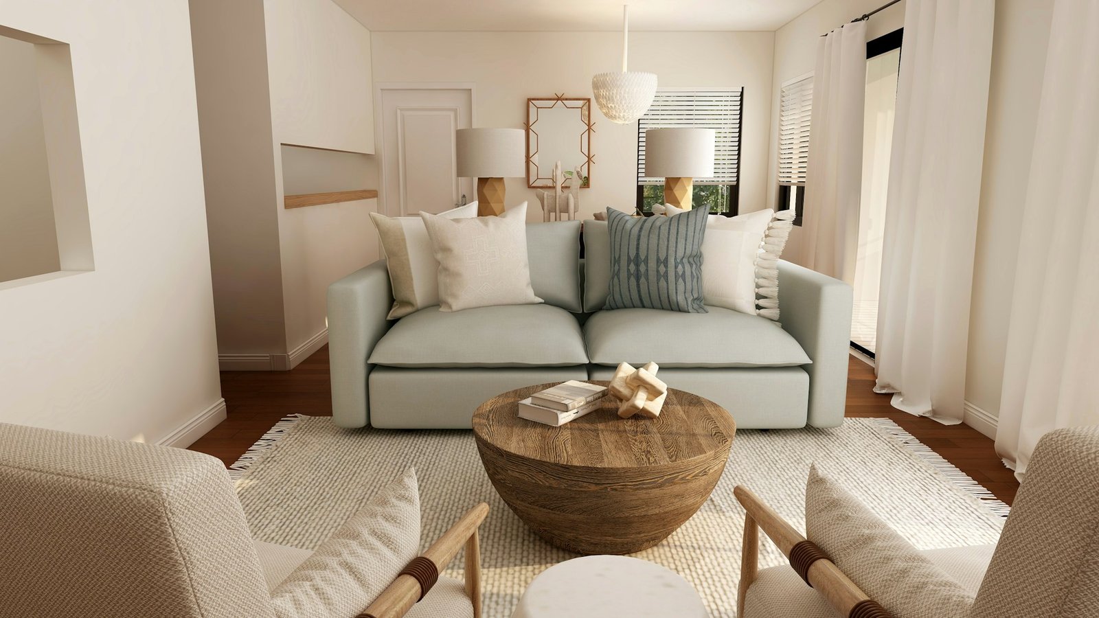 Bright, sunlit living room with a white sofa and a round wooden coffee table